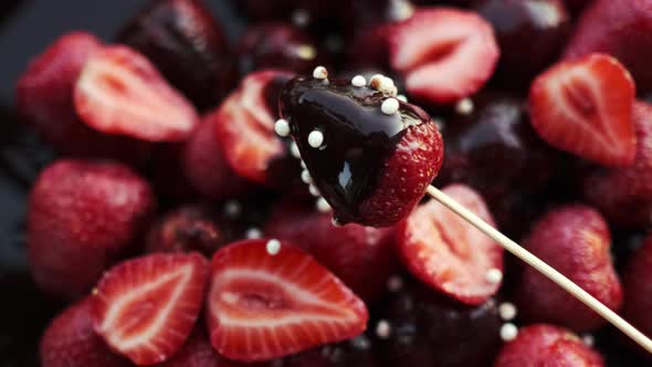 Ripe Strawberry Under Cacao Chocolate Rotating on Canape