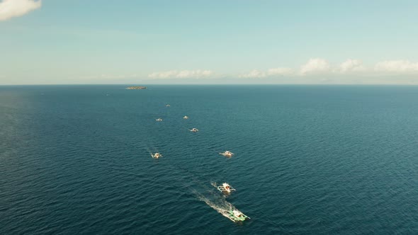 Local Filipino Boats in the Deep Blue Sea