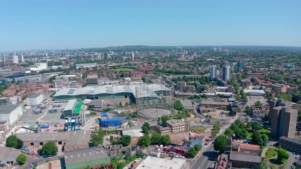 Dolly forward drone shot over industrial South East London on a sunny day