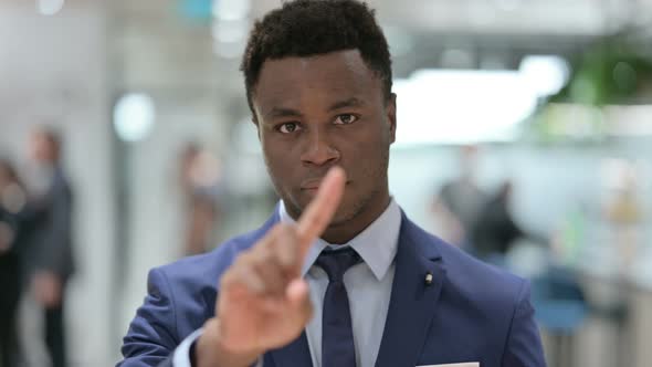 Portrait of African Businessman Showing No Sign By Finger Sign