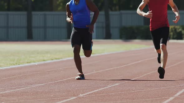 Men Running Around Stadium Doing Morning Exercises, Competition, Slow-Motion