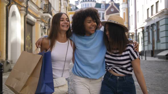 Teenage Friends Shopping During Sale Season