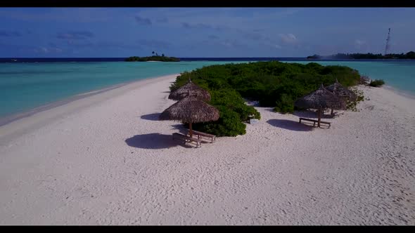 Aerial drone shot panorama of marine sea view beach time by blue lagoon and white sandy background o