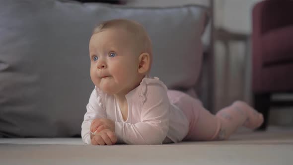  Indoor Portrait of Baby Girl Lying on the Belly