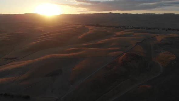 Gorgeous Southern California aerial during sundown.  Surrounding hillside is a golden brown.  Natura