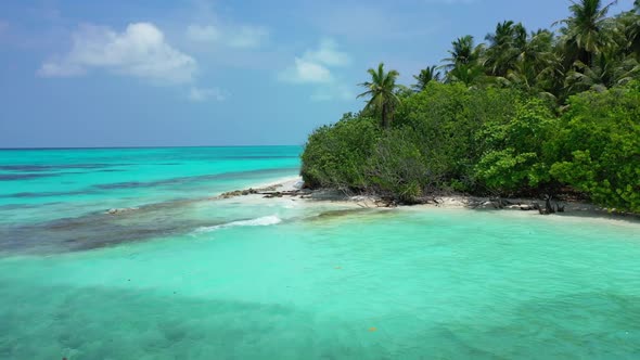 Aerial travel of idyllic coastline beach lifestyle by blue sea and white sandy background of journey