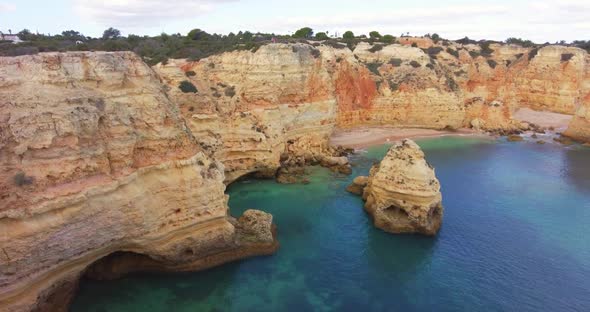 Aerial View of Tropical Exotic Golden Limestone Beach with Crystal Clear Water