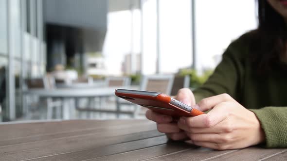 Woman Using Cell Phone at Outdoor