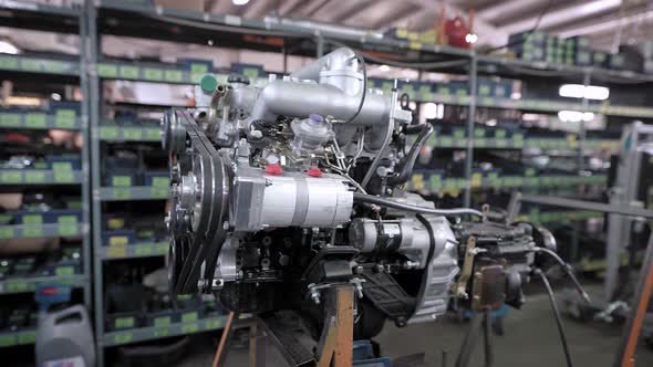 A New Car Engine in the Production Hall on a Special Stand