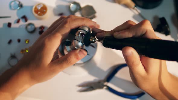 Polishing Process of a Ring with a Precious Stone. Jeweler Working Jewelry