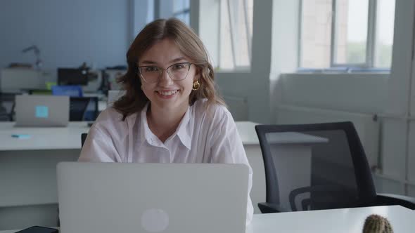 Close Up View of Smiling Office Worker That Watch on the Camera