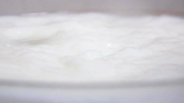 Fruit Mix Drops Into Milk