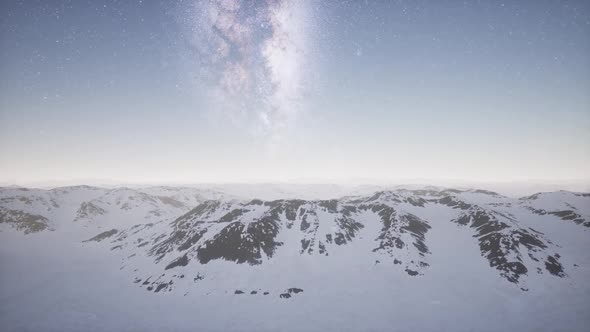Milky Way Above Snow Covered Terrain alt