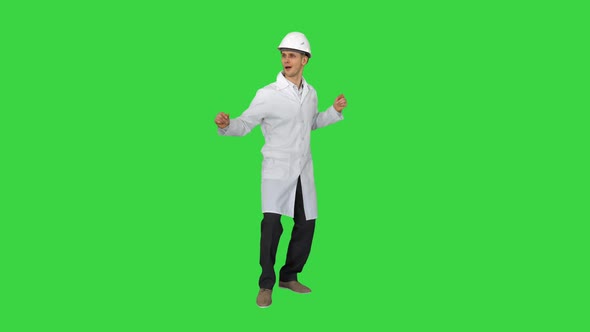 Engineer Man Dancing in Funny Way on a Green Screen, Chroma Key.