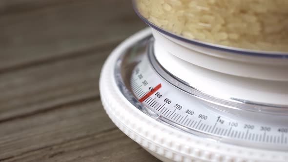 Kitchen Mechanical Scales. Weighing Rice For Cooking.