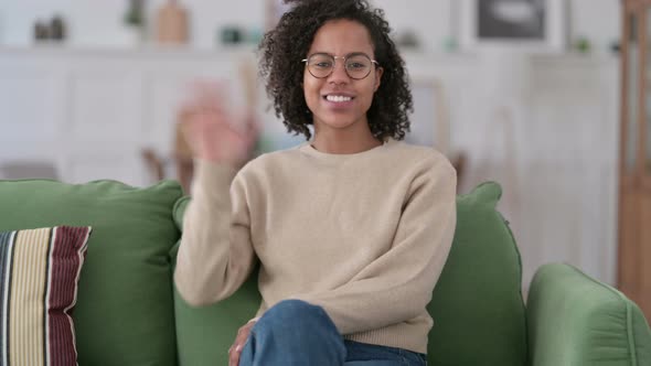 Welcoming African Woman Waving at Home