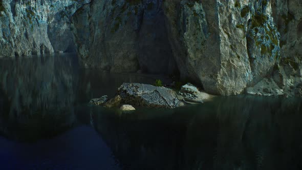 Rocky Cliffs in the Ocean at Sunny Day