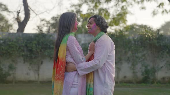 Indian couple getting romantic at Holi celebration