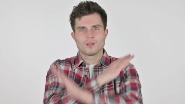 Portrait of Young Man Showing No Sign By Arm Gesture