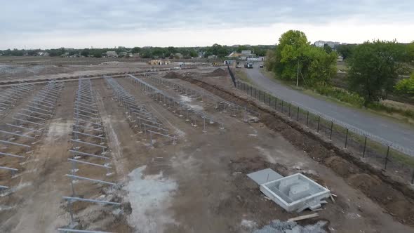 Construction Site of a Solar Power Station in the Field Lots of Mounting Racks