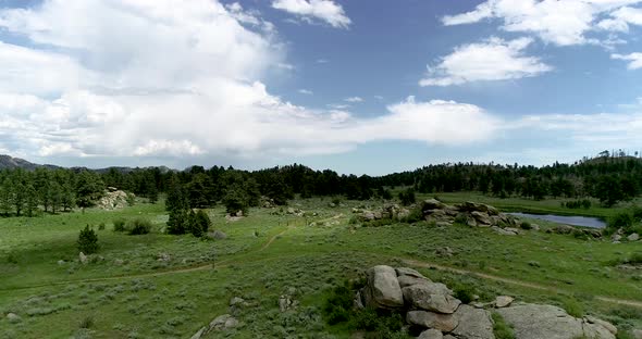 Beautiful smooth mountain drone flight in the highlands of Colorado.  The drone follows terrain.  Sh