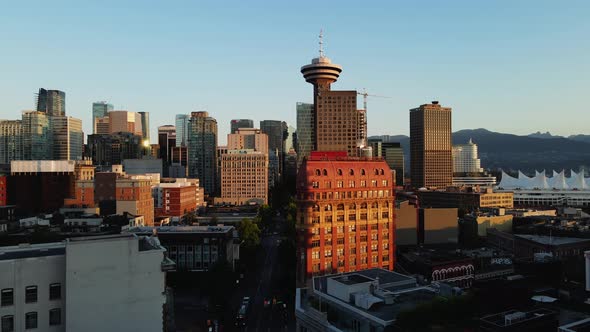 aerial drone footage of downtown Vancouver buildings, gas town, early sunrise, morning urban view. (