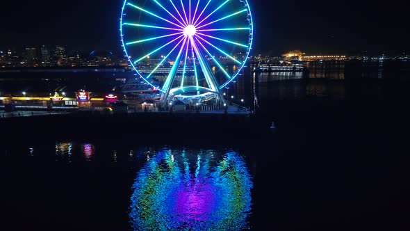 Seattle Waterfront Aerial with Ferry Boat Passing Pier at Night