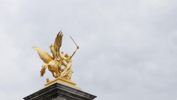 Alexandre III bridge over river Seine golden statues column detail in Paris France slow tilt 4K 2160