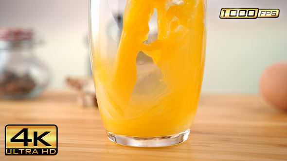 Orange Juice Splashing in the Glass