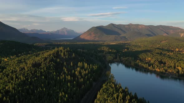 Majestic Mountains And Vast Forest Landscape Of Lake five in montana- aerial shot