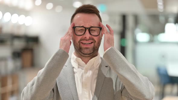 Exhausted Creative Man Having Headache