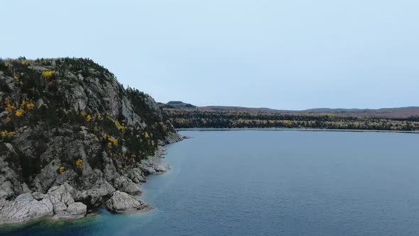 Drone flies up to the shore of Alona Bay, Lake Superior, Ontario, Canada