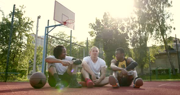 Team of Basketball Players Making a Break