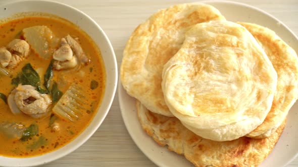 Chicken curry soup with roti or naan with chicken tikka masala - Asian food style