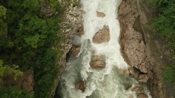 Descente Into a Deep Hadzhokh Gorge To a Fast White Stream of a Mountain River Belaya . Beautiful