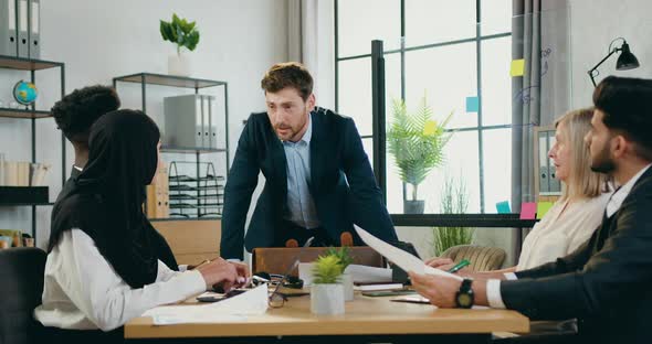 Mixed Race Confused Subordinates for Bad Made Work and Showing them their Mistakes