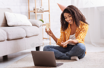 Black woman drinking wine during virtual online party / Photodune, Misc