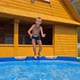 the boy is playing in the home pool - VideoHive Item for Sale
