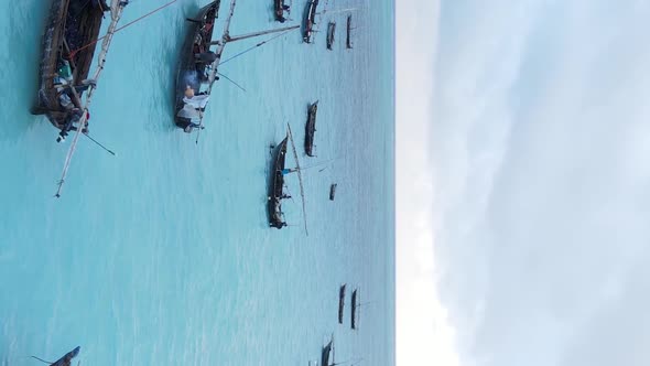 Tanzania Vertical Video  Boat Boats in the Ocean Near the Coast of Zanzibar Aerial View