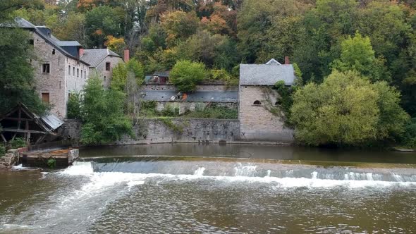 Drone rises from the moat at the fairytale castle Chateau De Walzin