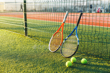 ourt. Equipment for playing tennis on grass.  Close-up tennis rackets.
