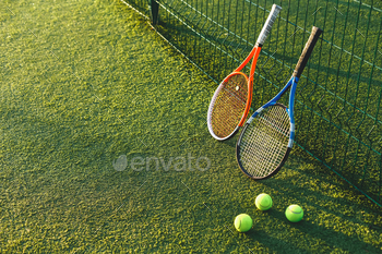 ourt. Equipment for playing tennis on grass.  Close-up tennis rackets.