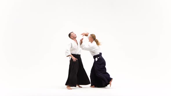 Two Guys Showing Aikido Using Tanto. Isolated, White. Close Up