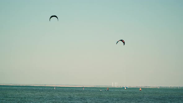 Kitesurfers on a Shallow Lake