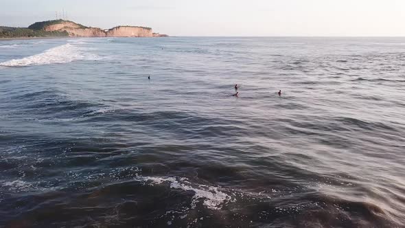 Drone Flying Over Surfers Surfing At Olon Beach In Ecuador. - aerial