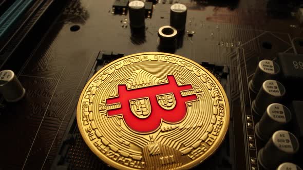 Gold Bit Coin BTC Coins on the Motherboard