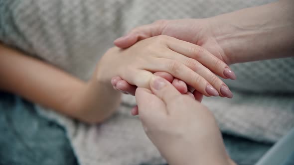 Massage - Female Masseuse Is Kneading the Beautiful Fingers of a Young Woman