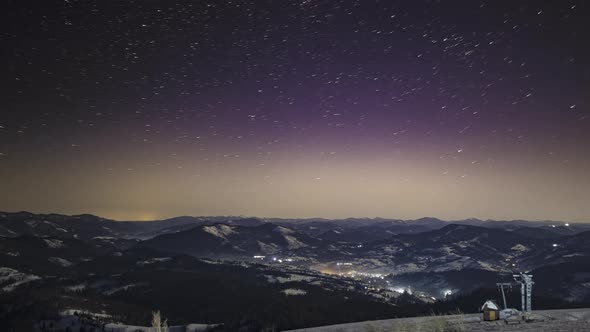 Night Starry Sky Over Village in Carpathians