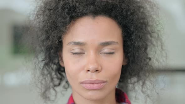 Close Up of African Woman Looking at the Camera