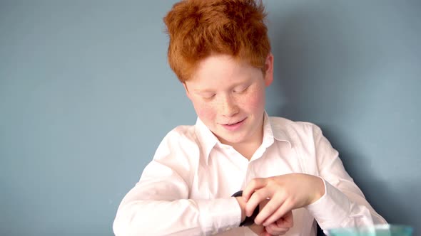 Boy talking into smartwatch